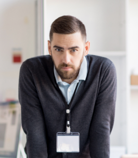 serious-office-worker-looking-at-camera-86QF37A.png
